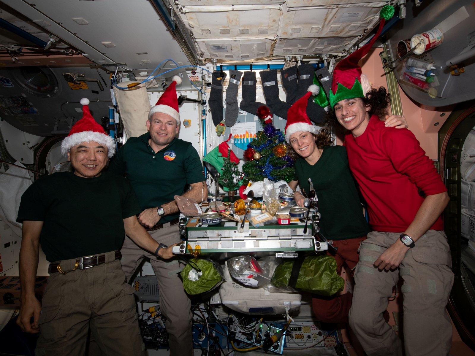 The Expedition 70 crew celebrates Christmas together aboard the International Space Station, December 25, 2023.